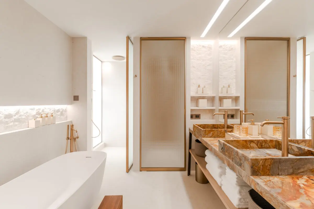Luxurious bathroom at Villa Dubrovnik, a Croatia destination wedding hotel with marble sinks and a modern bathtub.
