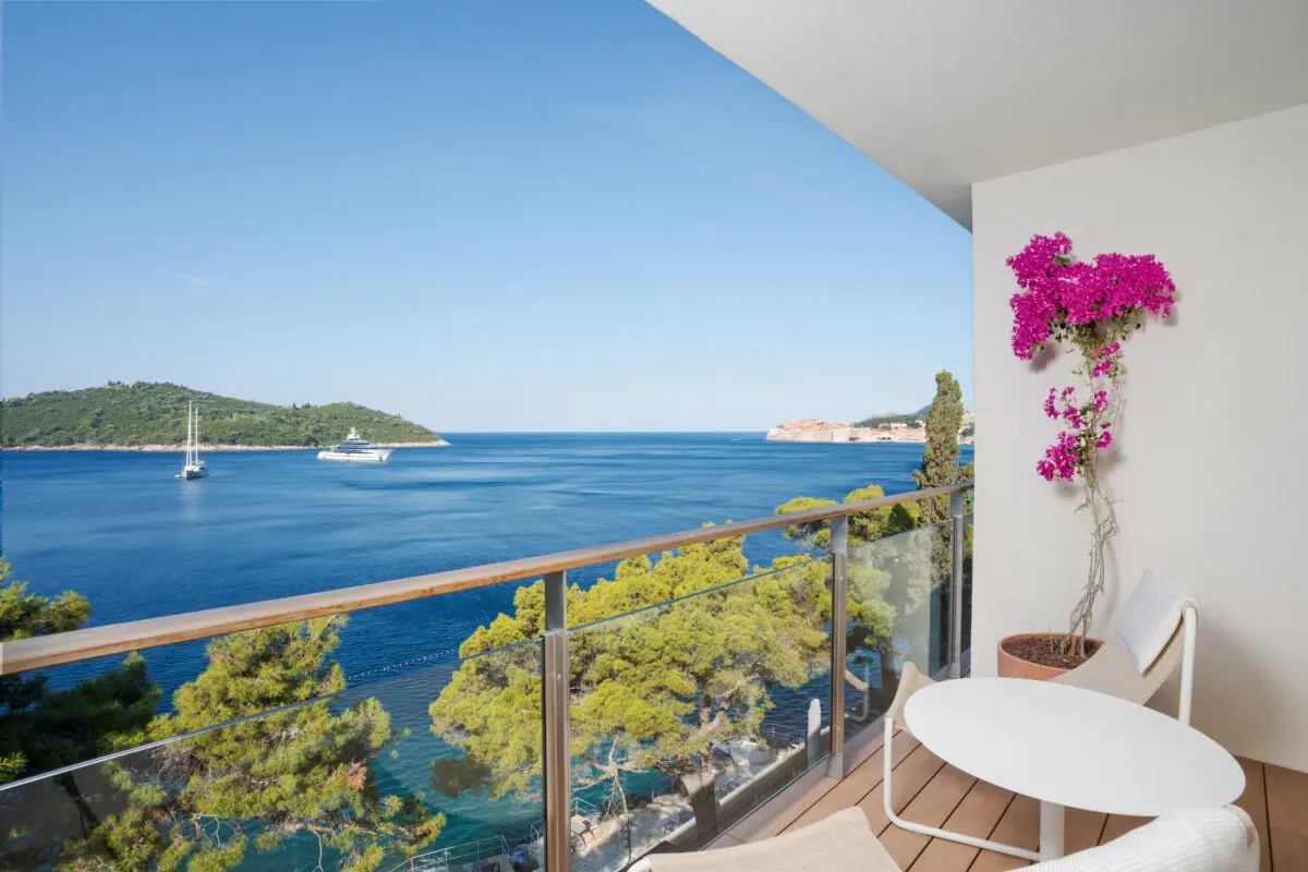 Balcony view from Villa Dubrovnik, a Croatia destination wedding hotel, overlooking the Adriatic Sea with yachts.