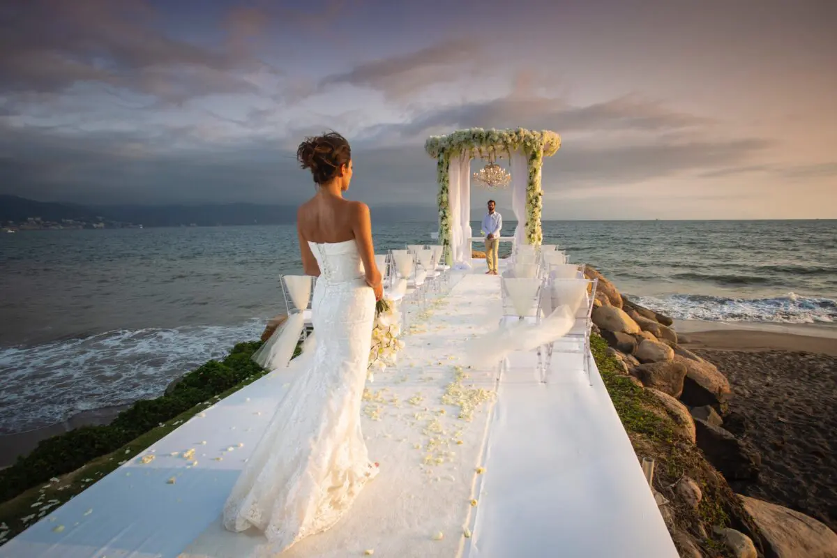 Bride at a Puerto Vallarta wedding ceremony at Velas Vallarta, waiting for the groom.
