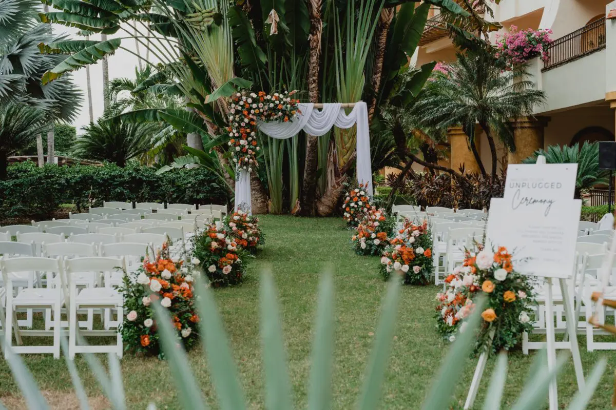 Wedding ceremony setup at Velas Vallarta in Puerto Vallarta with floral arrangements and an 