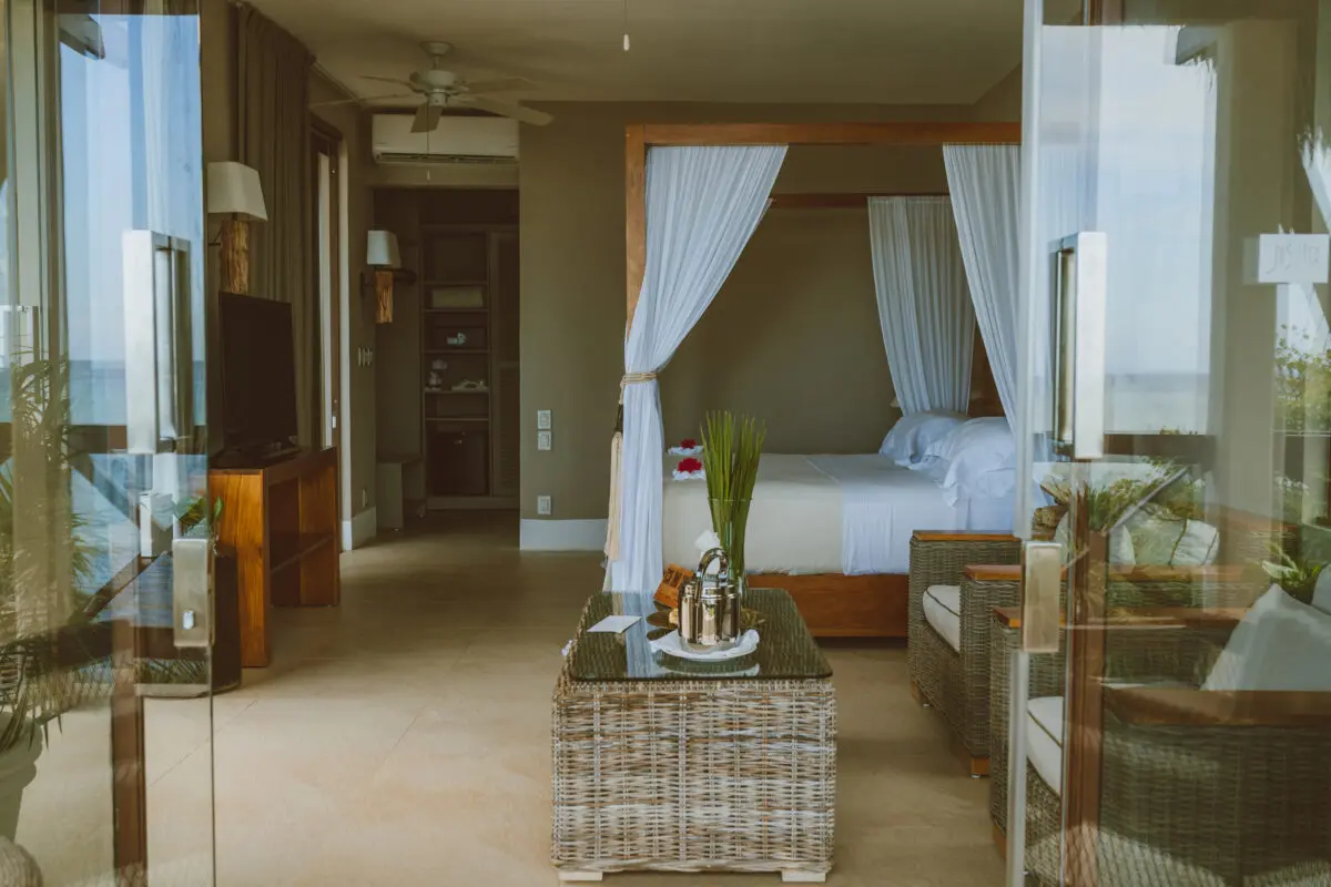 Jashita Hotel Tulum suite with canopy bed, ocean view. Possible Tulum wedding venue.