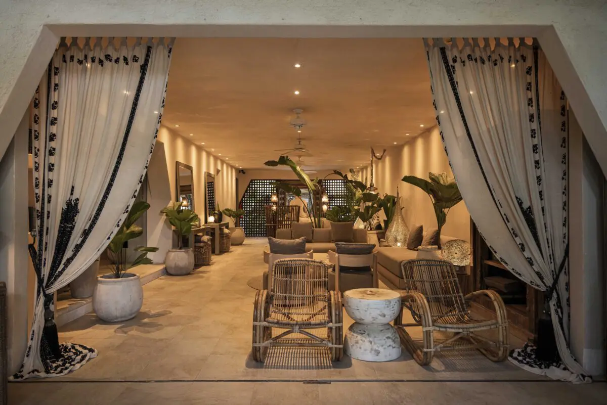 Jashita Hotel Tulum lobby with rattan chairs and tropical plants. A potential Tulum wedding venue.