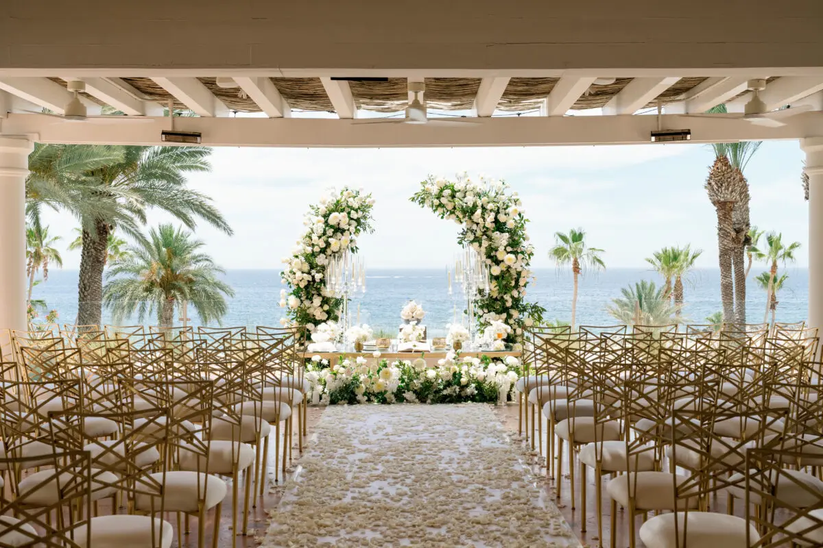 Los Cabos destination wedding setup with floral arch at Hilton Los Cabos.