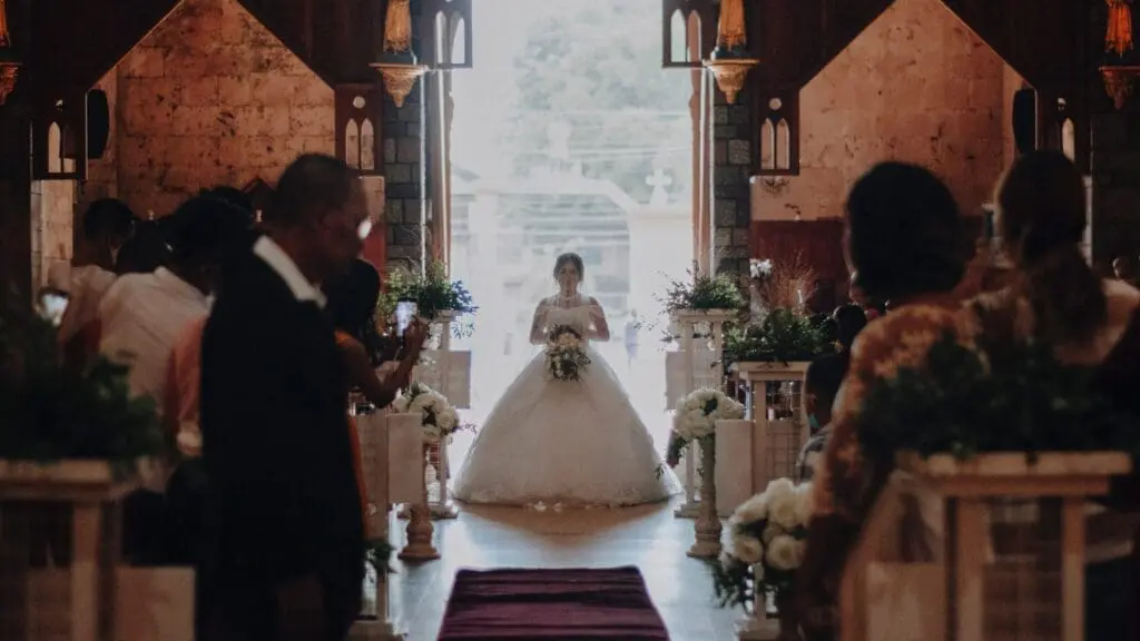 Bride walking down the aisle in a Portuguese wedding ceremony
