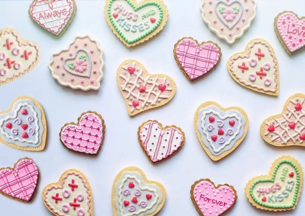 Colorful heart-shaped Valentine's Day cookies with frosting designs