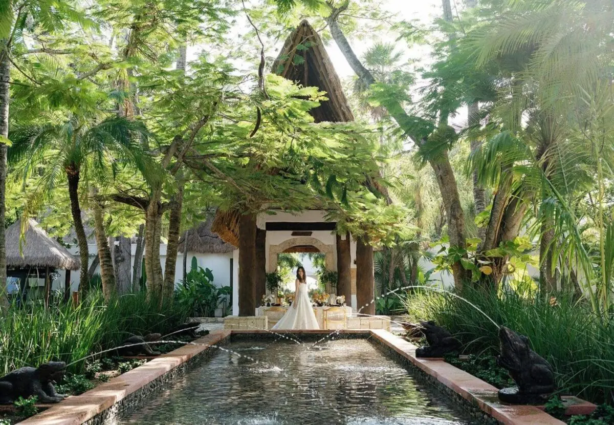 Bride in wedding dress at a luxury Mexican resort wedding venue.