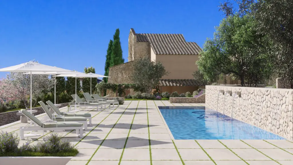 Modern villa poolside with lounge chairs and stone wall fountain