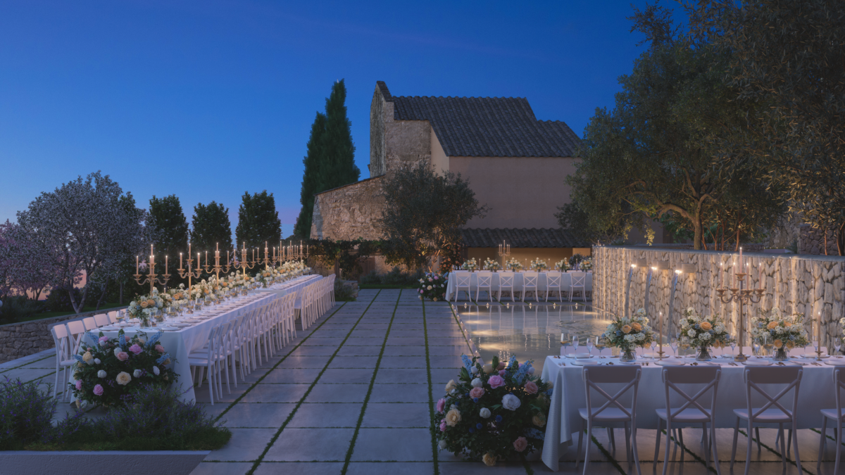 Elegant outdoor dining setup at dusk in a villa courtyard
