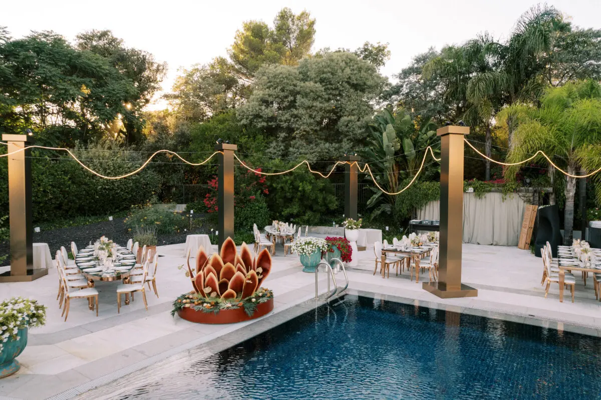 Luxury wedding reception setup poolside in Saint-Tropez.