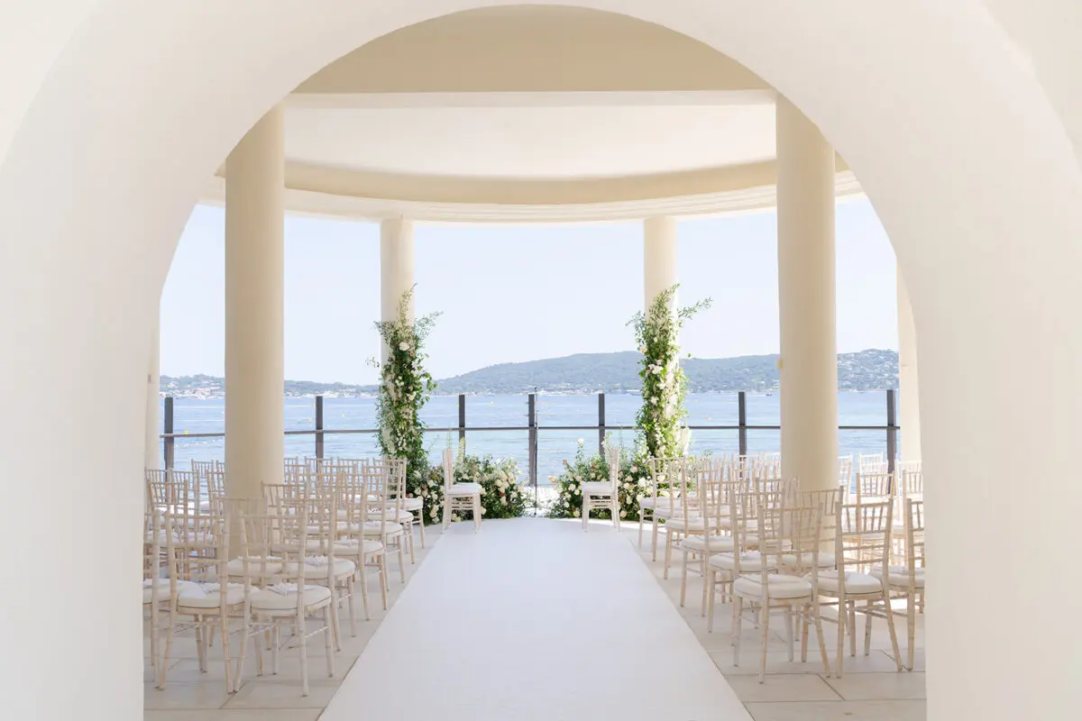 Luxury wedding in Saint-Tropez at COMO Le Beauvallon: Ceremony setup with sea view.