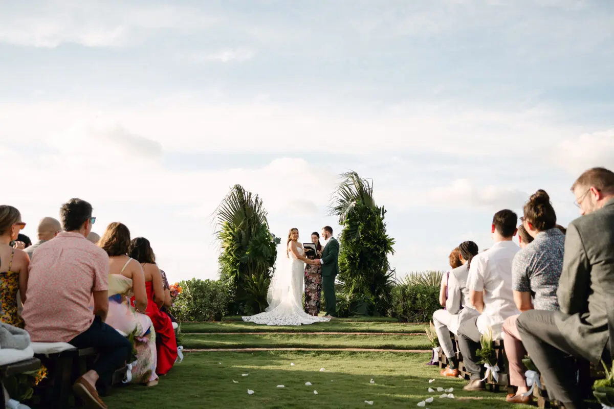 Rancho Santana wedding ceremony with bride and groom at the altar, surrounded by guests.