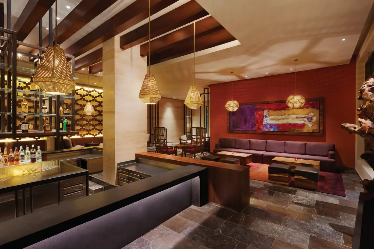 Hyatt Ziva Cancun lounge with stylish bar and seating area.