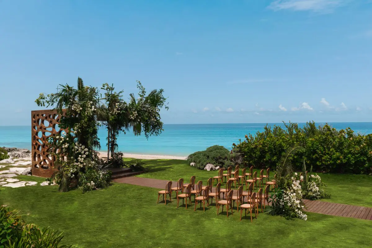 Luxury wedding venue in Cancun with ocean views and beautiful floral arch.