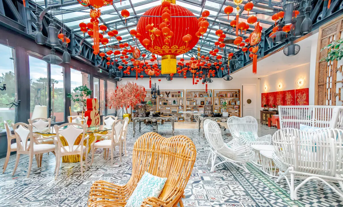 Festive indoor space at COMO Le Beauvallon, decorated for luxury weddings in Saint-Tropez with red lanterns and elegant seating.