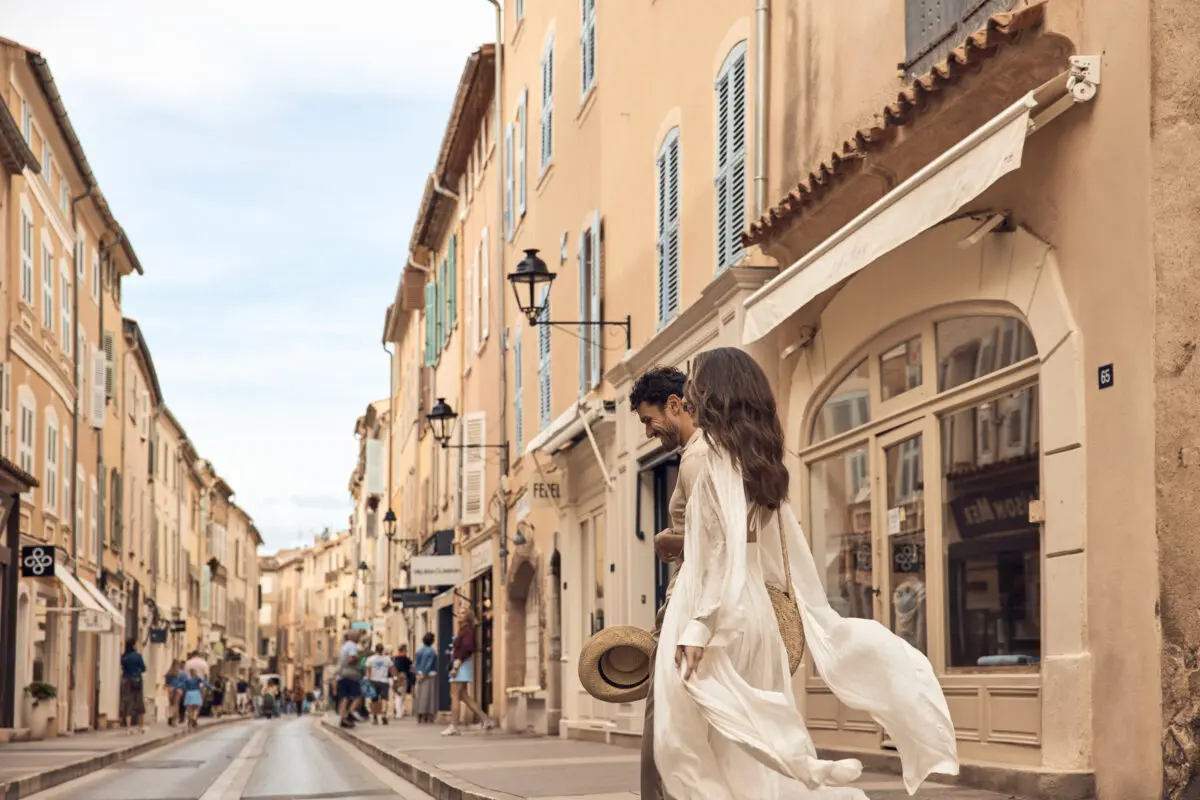 Couple walking in historic Saint-Tropez street