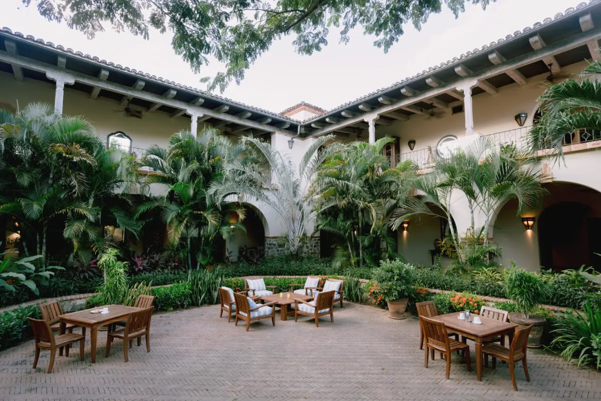 Tropical courtyard with patio seating at Rancho Santana