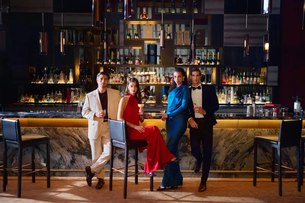 Elegant group at a bar, St. Regis Cap Cana Resort.