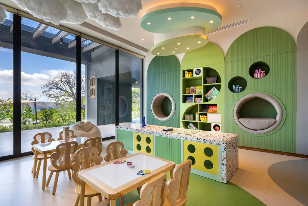 Playful kids' area at Waldorf Astoria Costa Rica, with colorful decor and natural light.