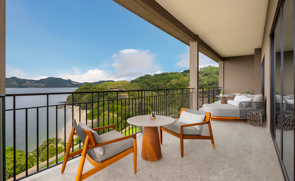 Waldorf Astoria Costa Rica balcony view with chairs and ocean vista.