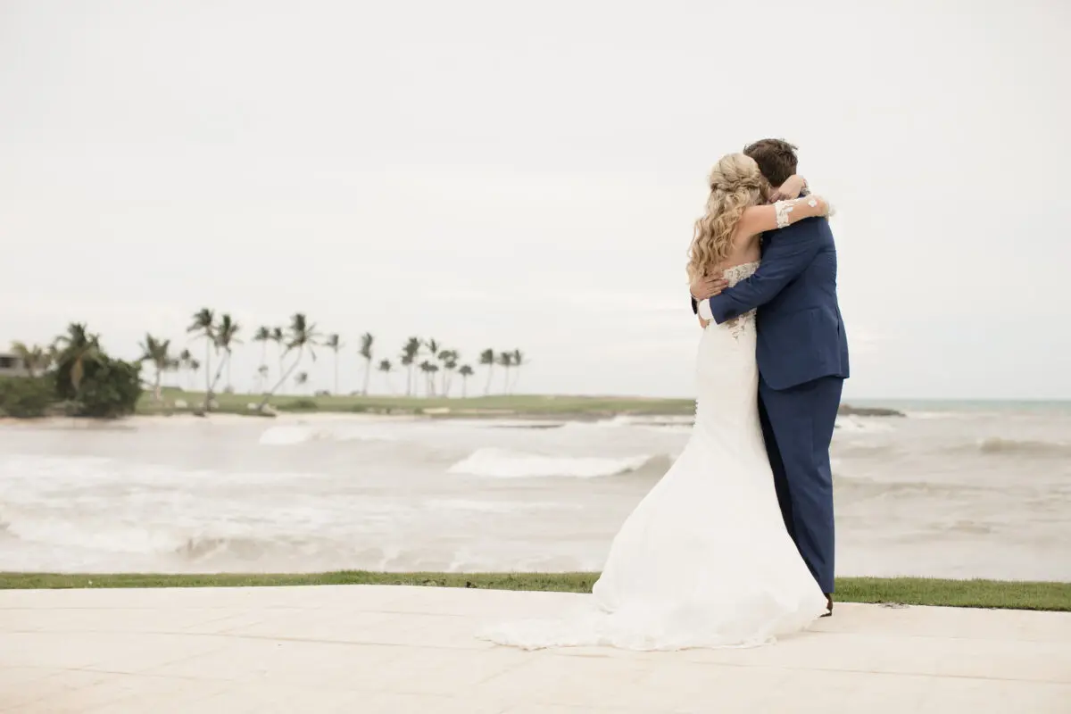 Bride and groom embracing at an exclusive wedding resort in Punta Cana, ocean view