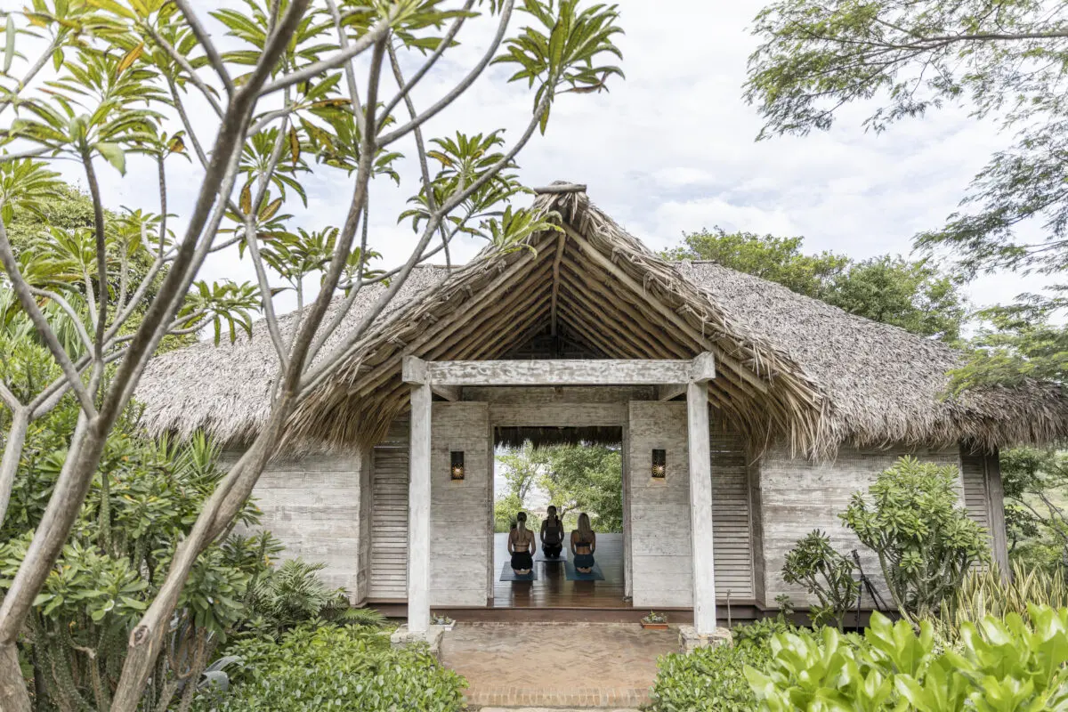 Tropical entrance with thatched roof at Rancho Santana