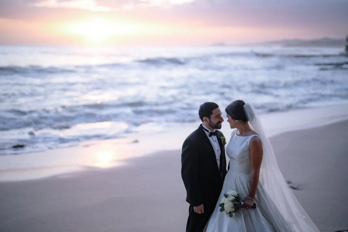 Rancho Santana wedding: Bride and groom on a beach at sunset.