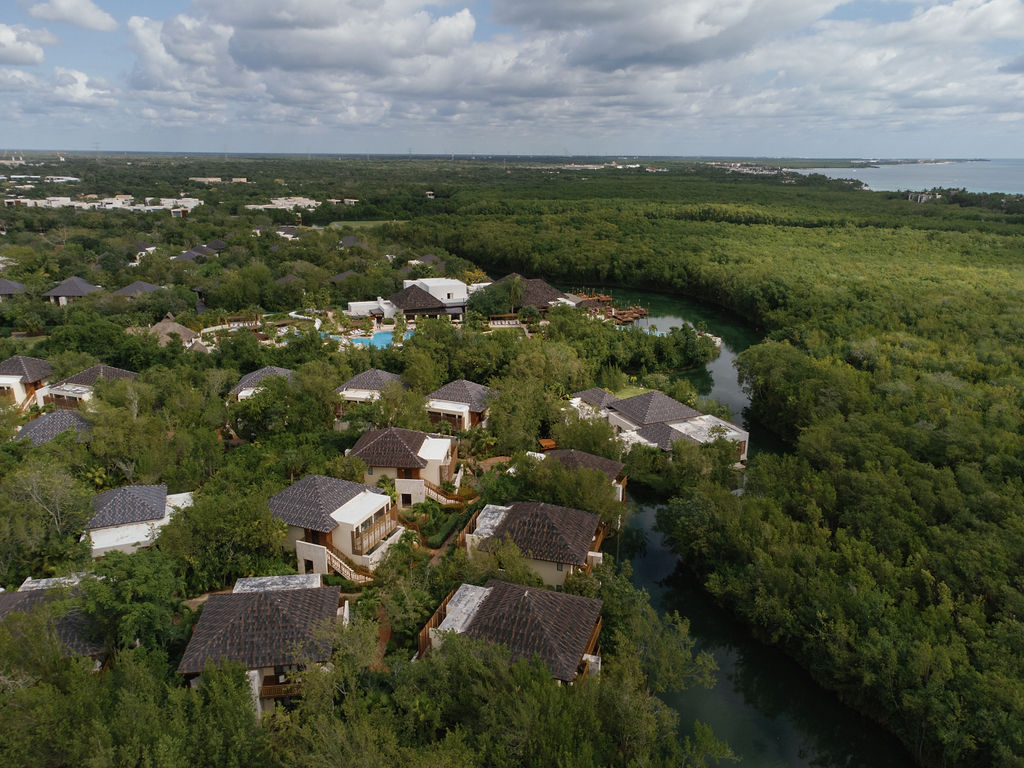 Banyan Tree Mayakoba resort aerial view, showcasing villas nestled in Riviera Maya's lush landscape.