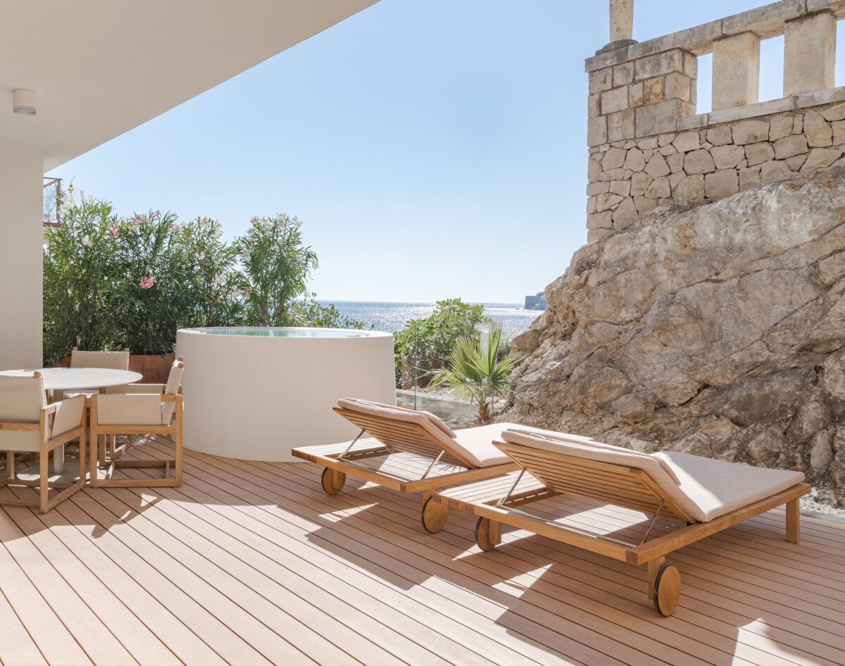Luxury Croatia Destination Wedding Hotel patio with loungers and ocean view.