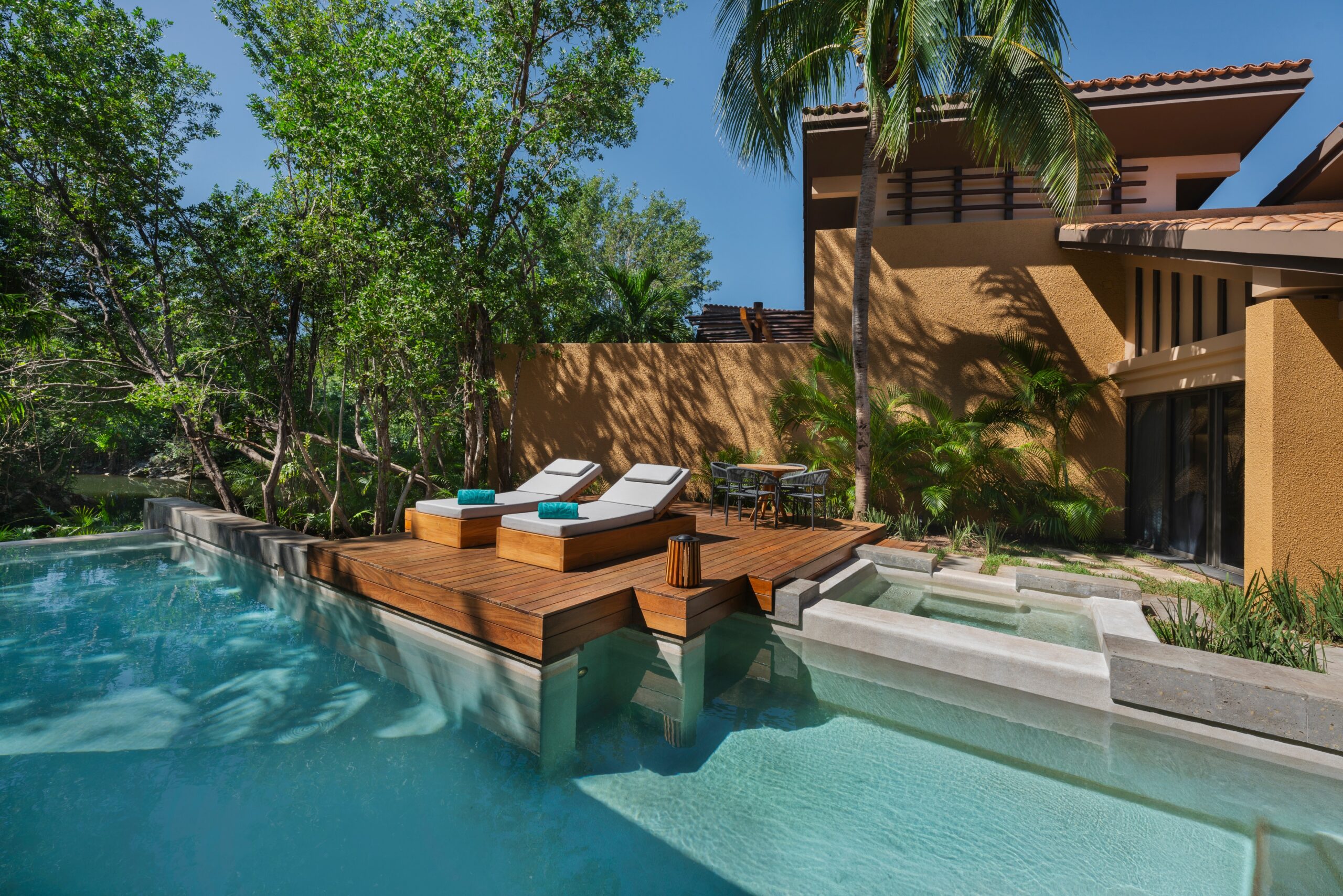 Banyan Tree Mayakoba villa with private pool and lounge chairs. Riviera Maya Ceremonies venue.