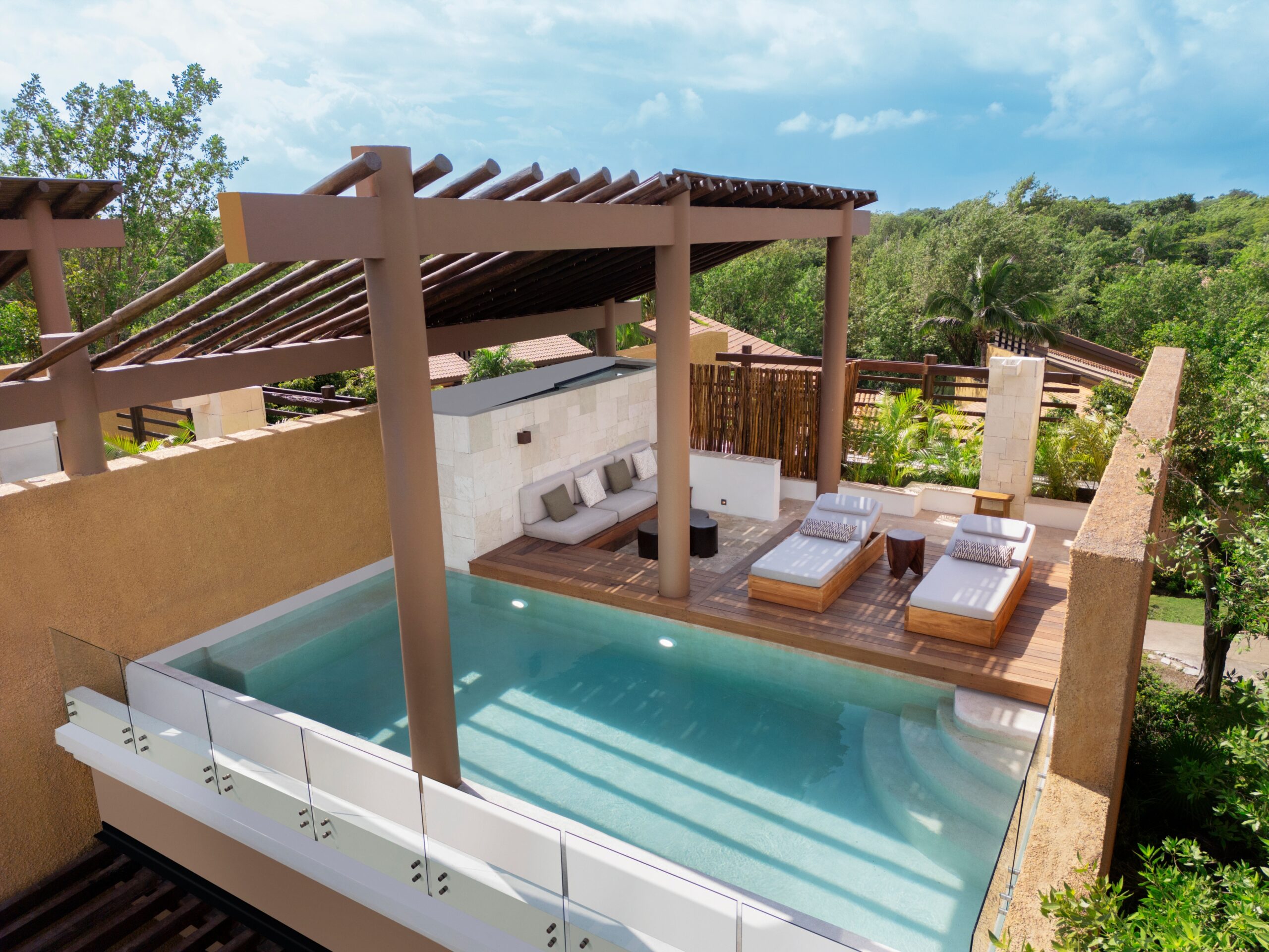 Banyan Tree Mayakoba rooftop pool with lounge area.