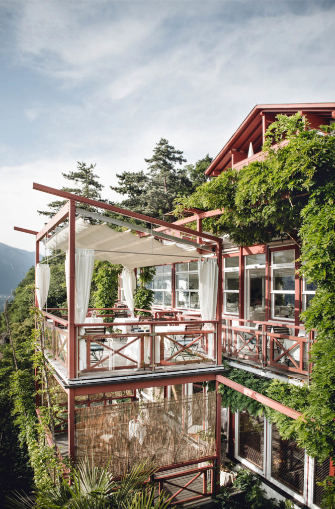 indoor outdoor venue suspended on the side of a mountain