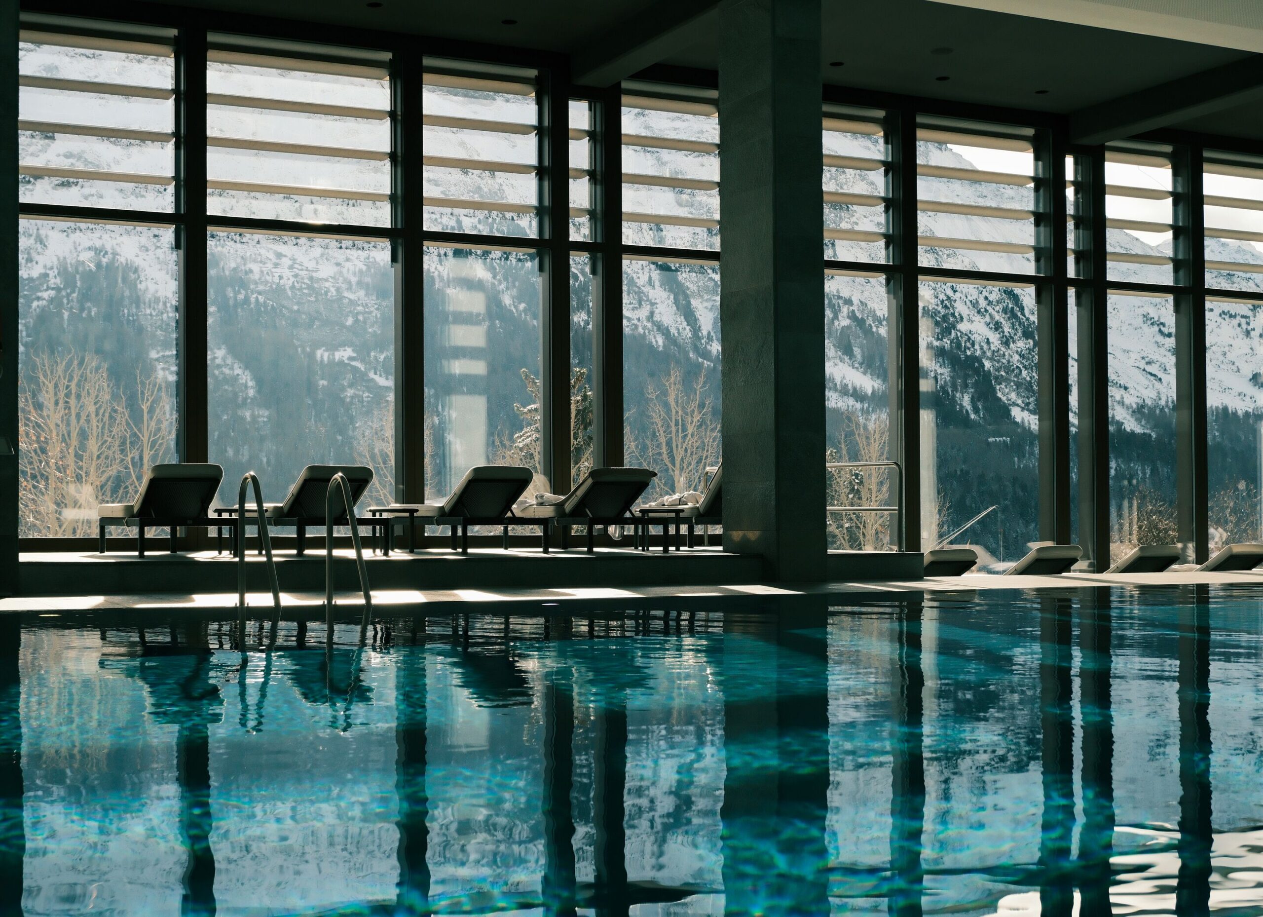 Indoor pool at Kulm Hotel St. Moritz with mountain views. Switzerland wedding venue.