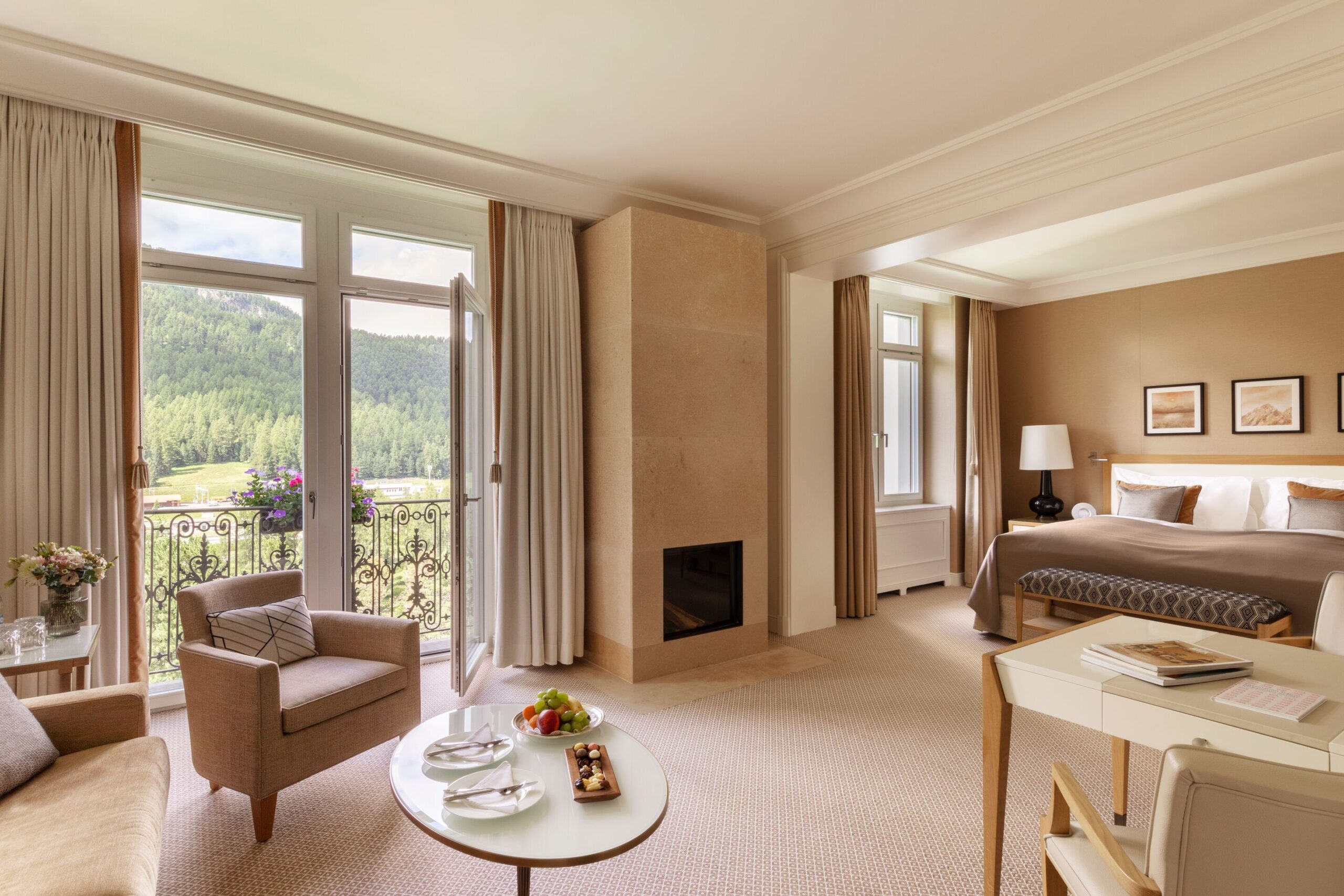 Grand Hotel Kronenhof suite with balcony view of the Swiss Alps.