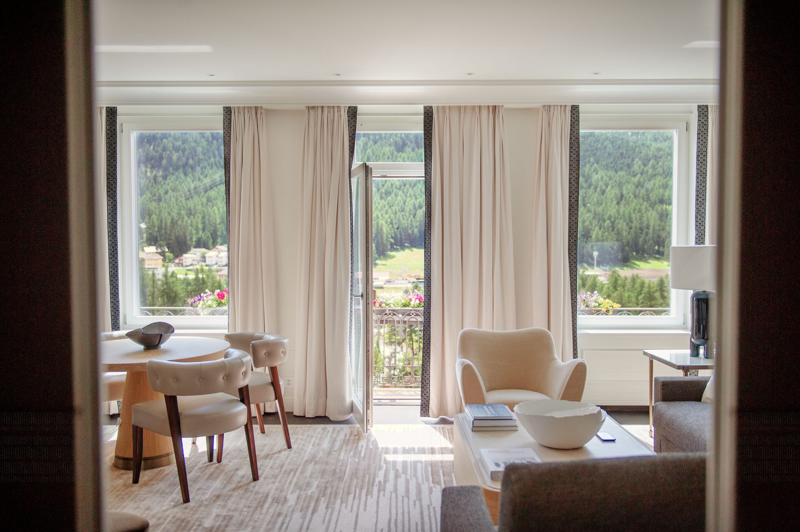 Grand Hotel Kronenhof suite with Swiss Alps view from the balcony.