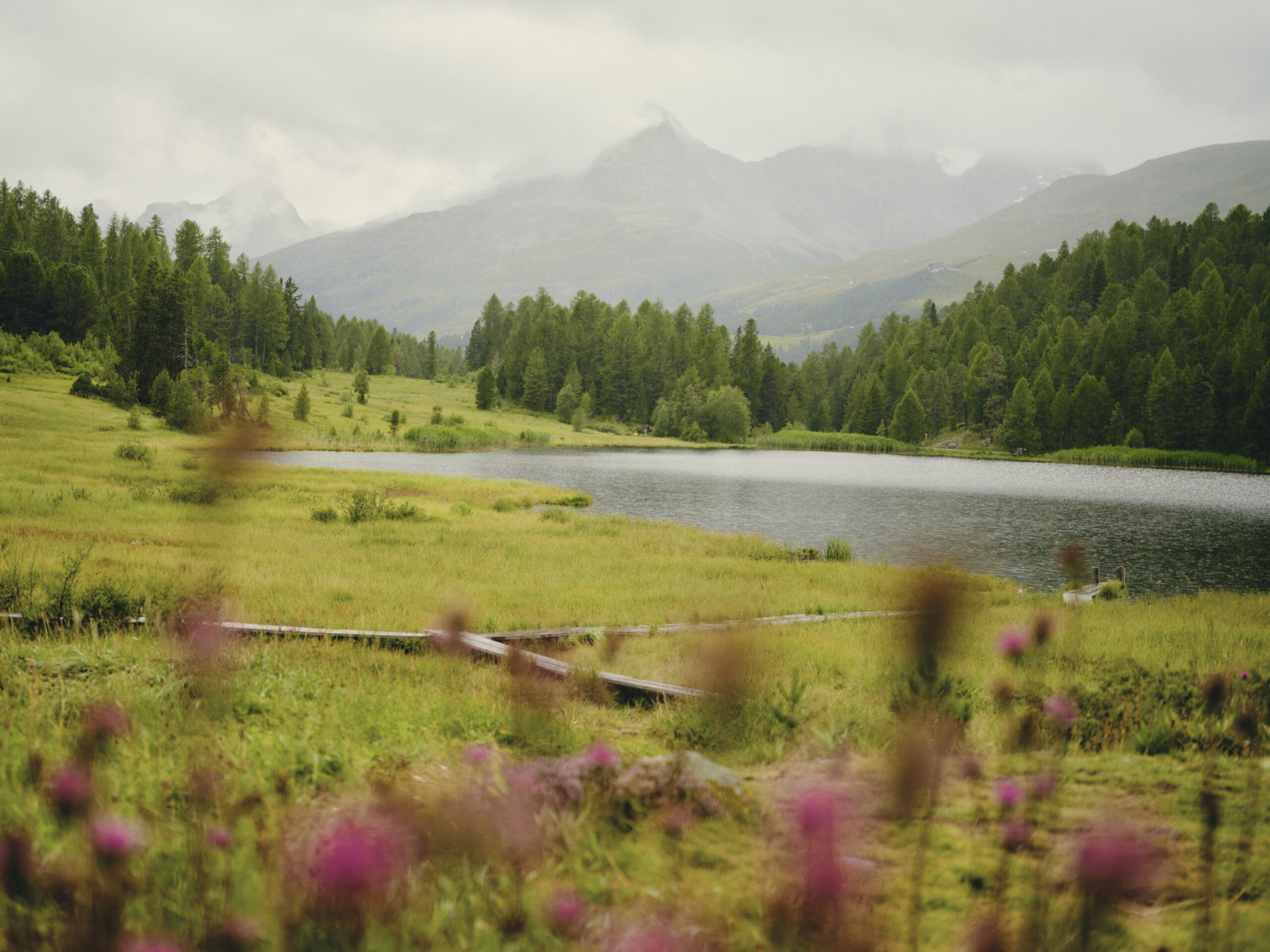 Serene Swiss Alps lake and mountains, perfect for a wedding venue at Grand Hotel Kronenhof.