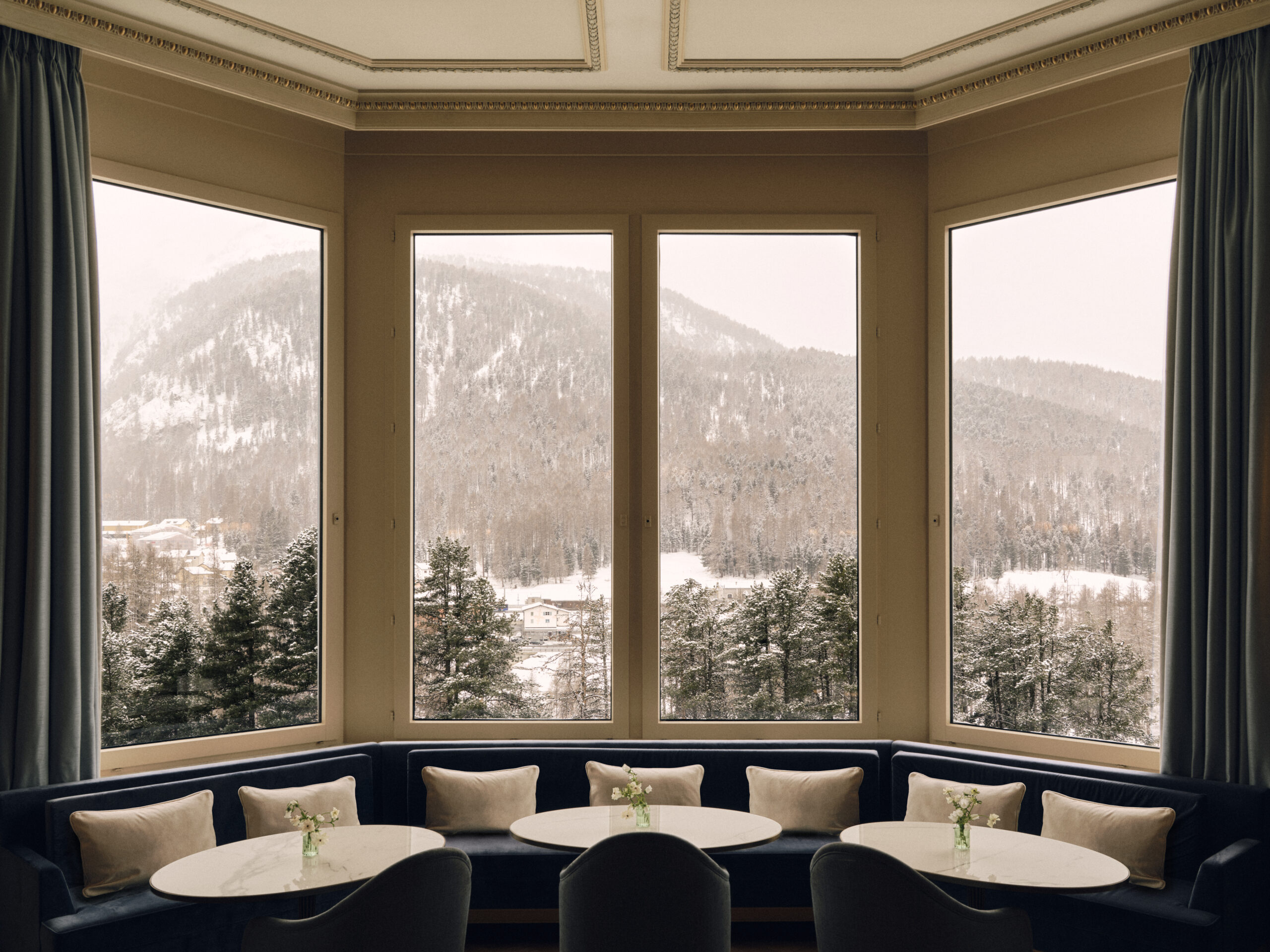 Elegant bay window seating at Grand Hotel Kronenhof with Swiss Alps view