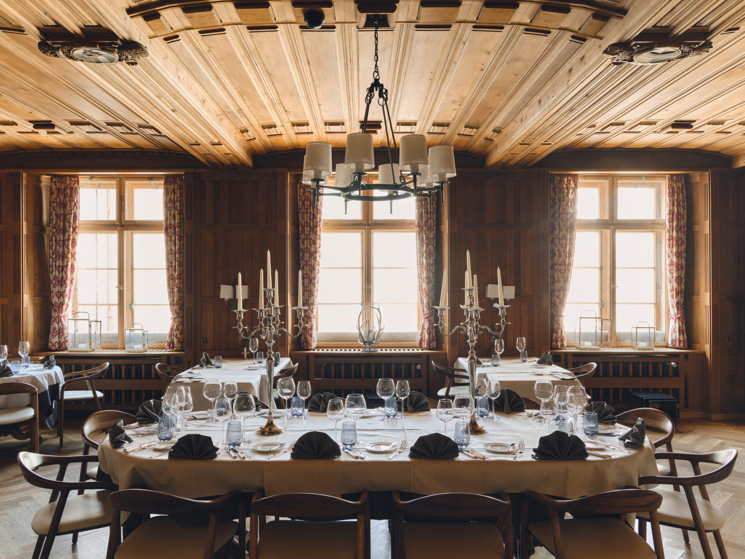 Elegant dining room at Grand Hotel Kronenhof, set for a Swiss Alps wedding.