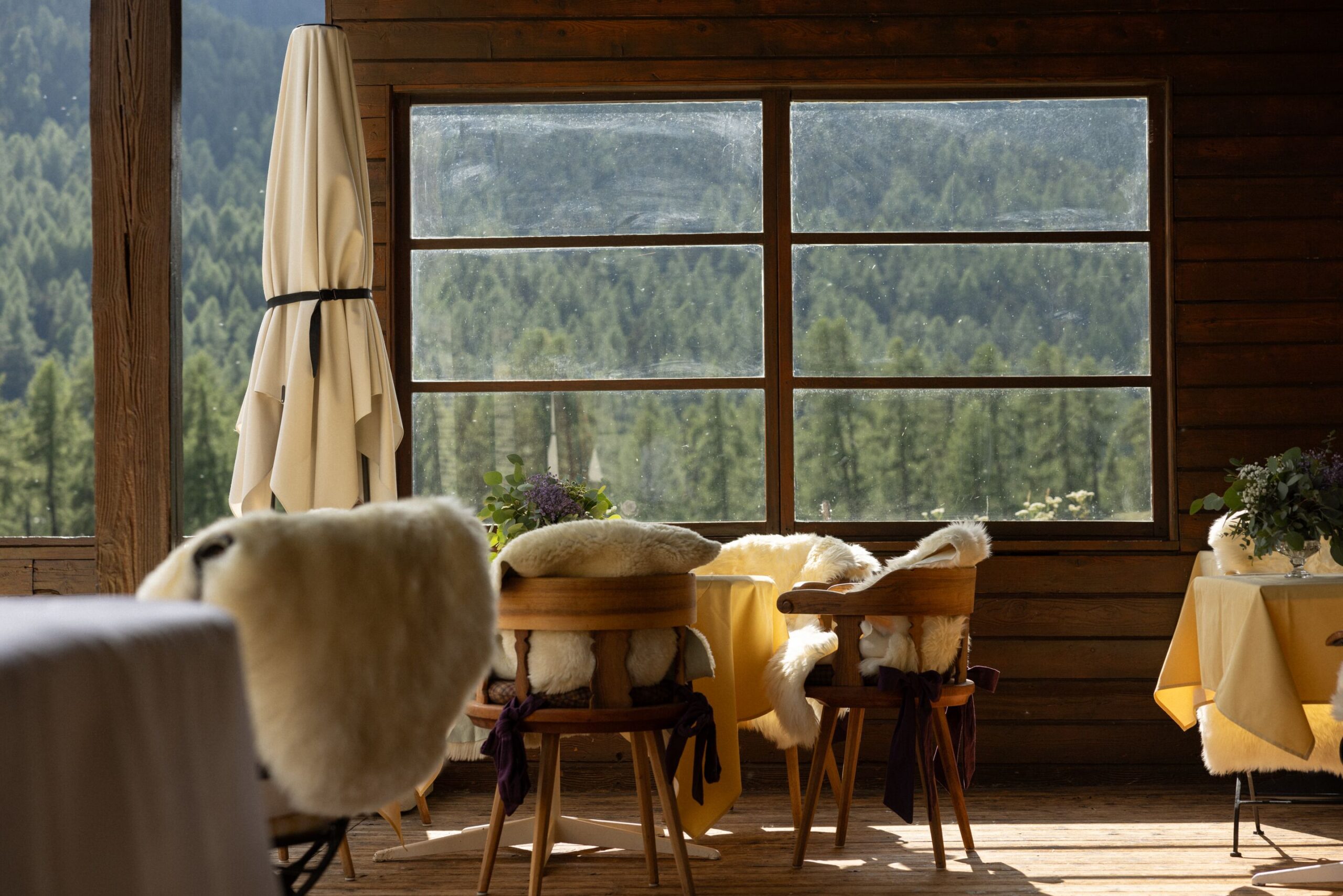 Cozy dining area with Swiss Alps view, possibly for a Grand Hotel Kronenhof wedding.