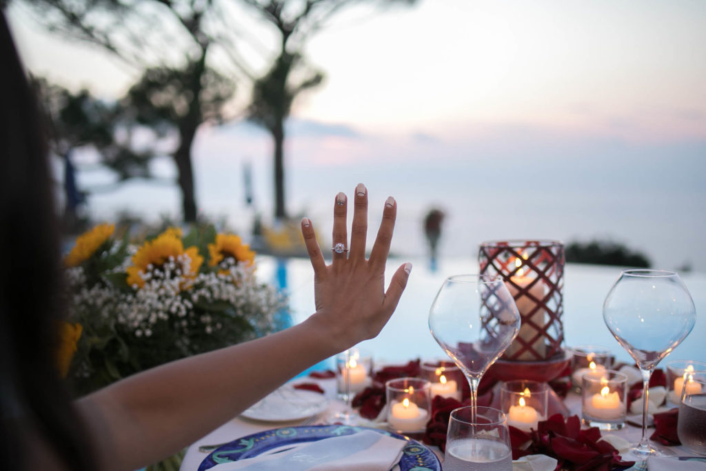 Left hand of a woman with an engagement ring