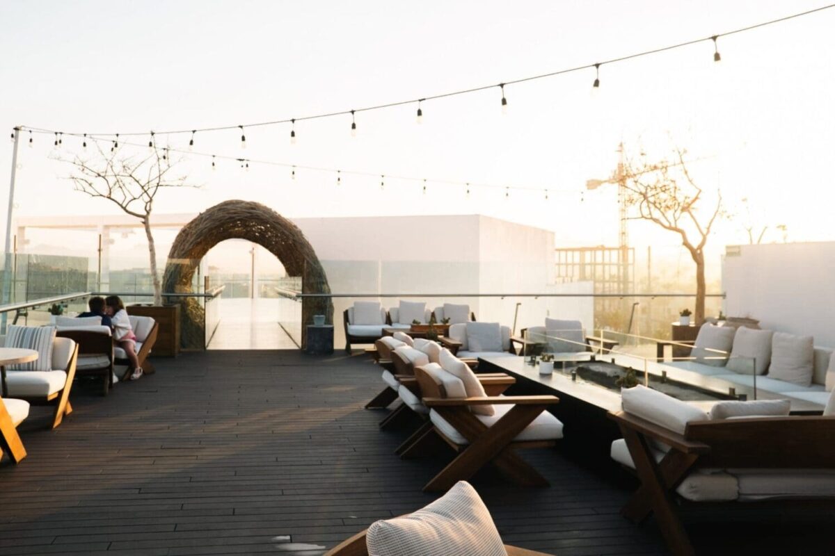 Couples relax on a rooftop terrace at the Viceroy Los Cabos, a luxury Mexico beach resort.