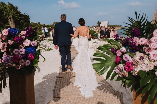 Couple walking up the aisle at their wedding