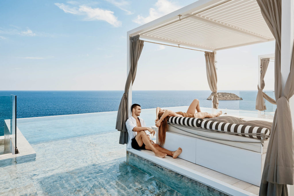 Couple relaxing in cabana at the beach