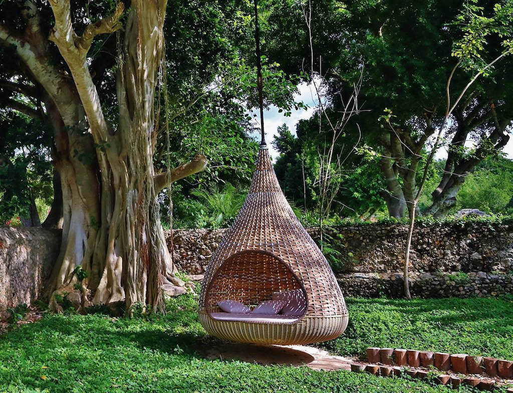 TEARDROP CHAPED CHAIR HANGING FROM TREE