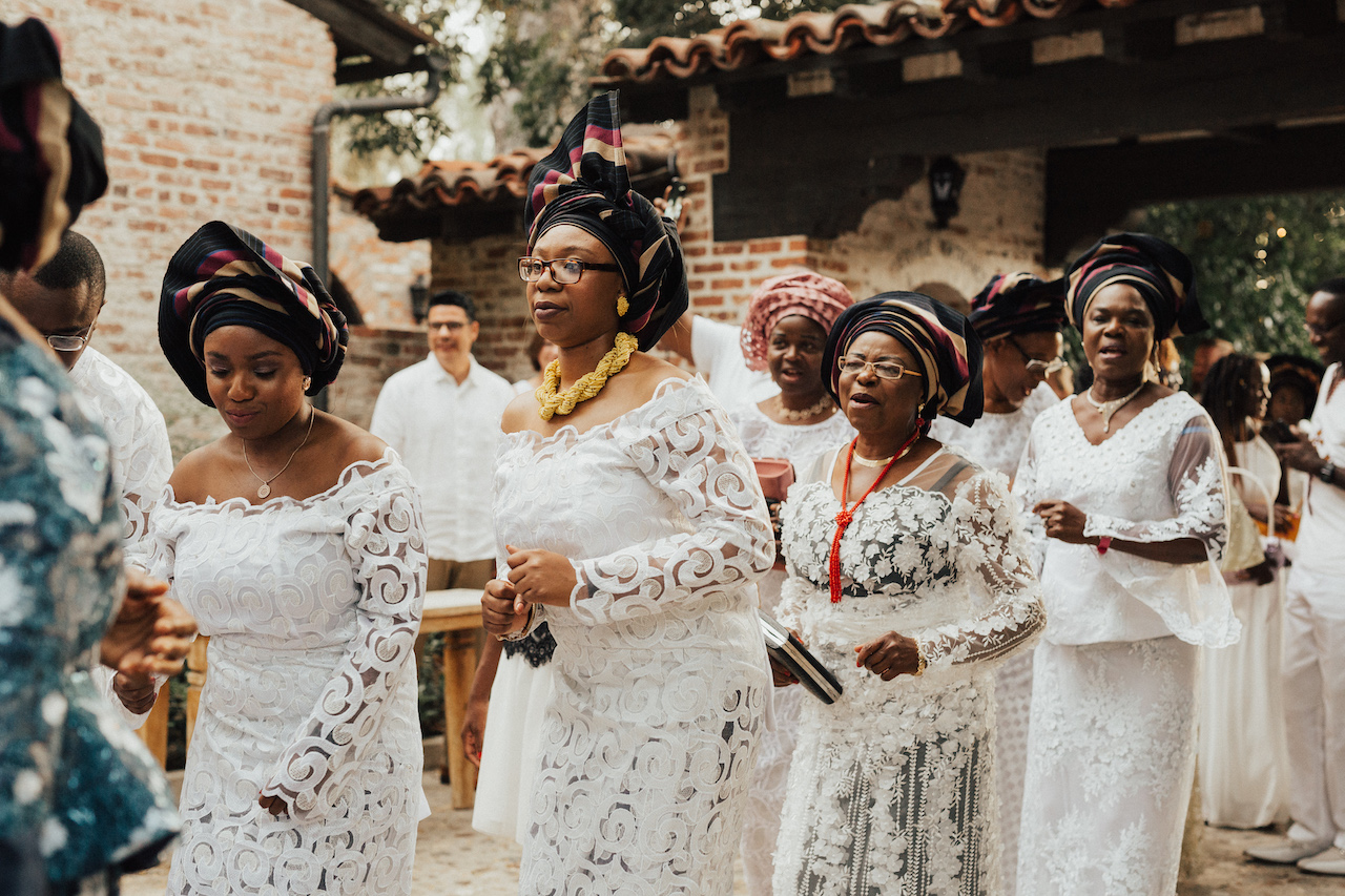 Nigeerian wedding guests dressed in white