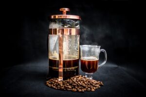 French press coffee, beans & clear cup of coffee