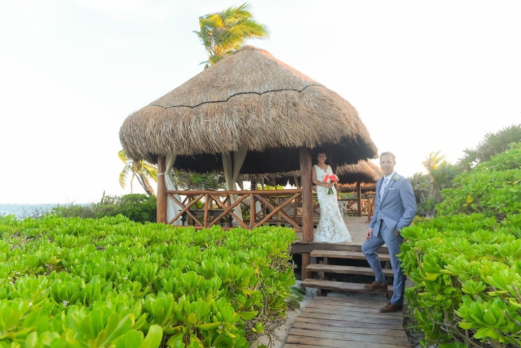 bride & groom under a palapa