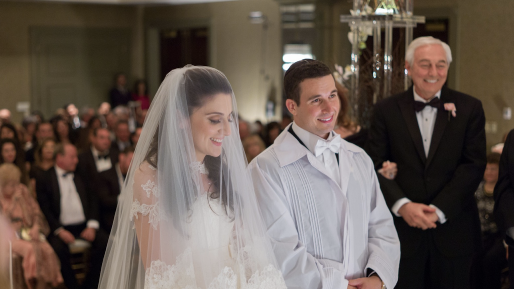 Orthodox jewish couple under chuppah