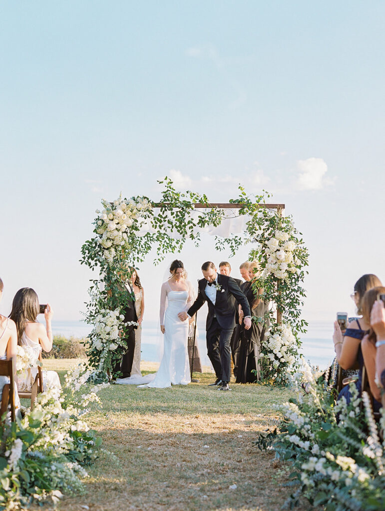 Jewish groom breaking the glass under the chuppah