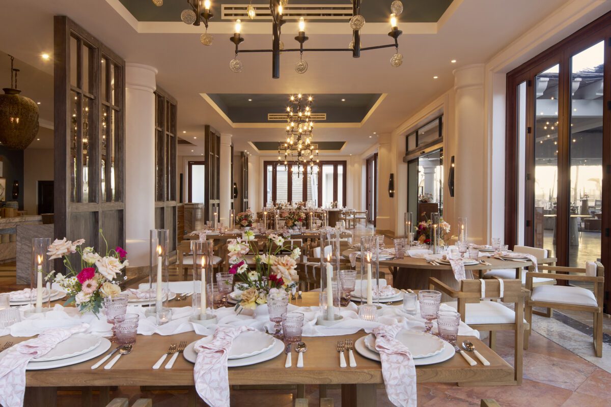 Los Cabos destination wedding reception at Hilton Los Cabos with elegant table settings and floral centerpieces.
