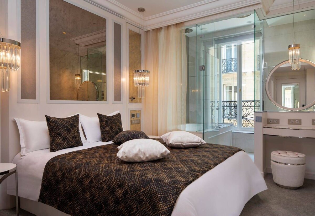 Luxurious Paris hotel bedroom with a view; perfect for a honeymoon.